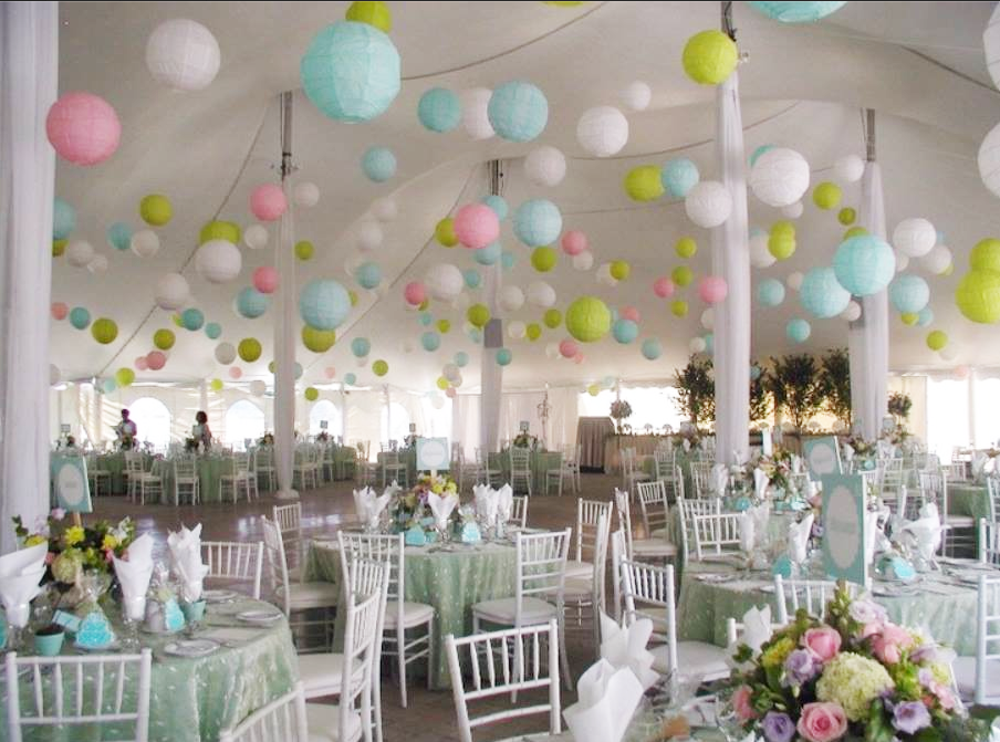 Pastel paper lanterns in wedding marquee