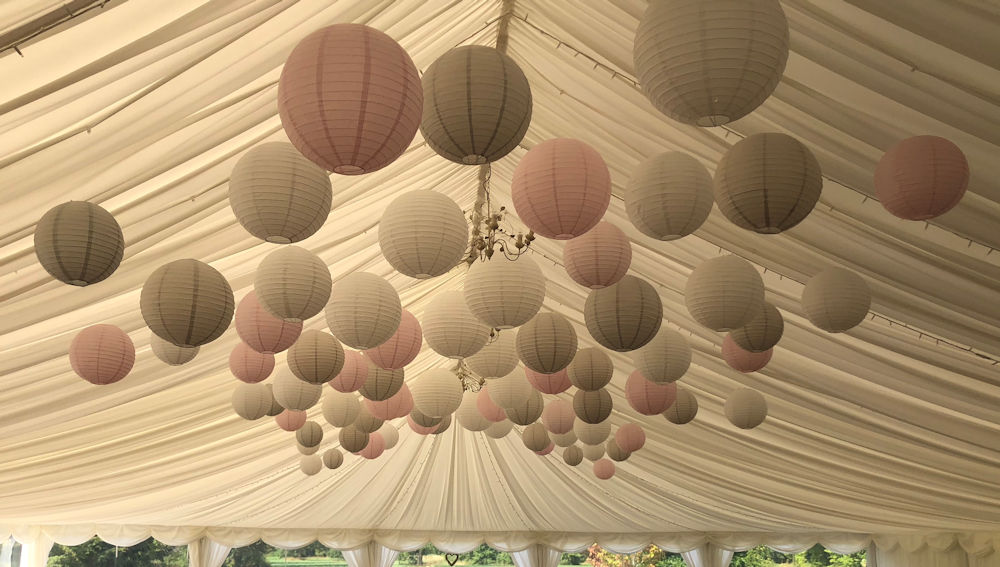 Pink and dove paper lantern canopy at Kingston Bagpuize House