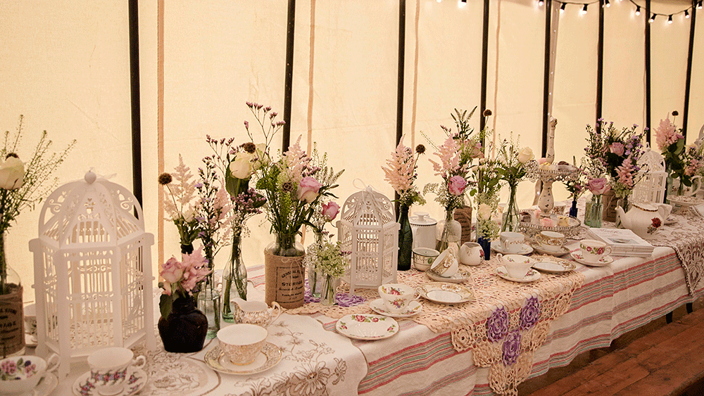 Delicate birdcage lanterns add to a 1940s style afternoon tea
