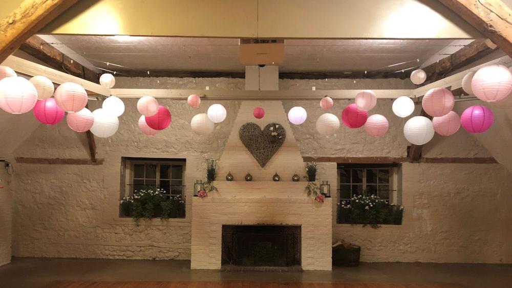 Pink Paper Lanterns in the barn at Dorset House School, Pulborough