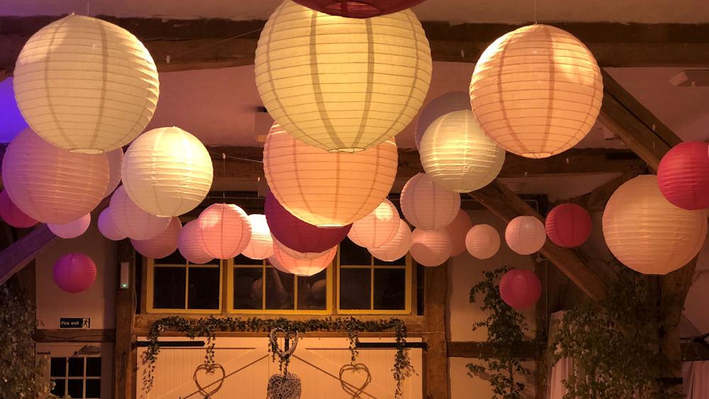 Pink Paper Lanterns in the barn at Dorset House School, Pulborough