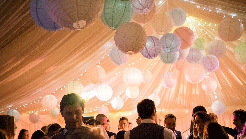 Pastel paper lanterns create a festival themed wedding