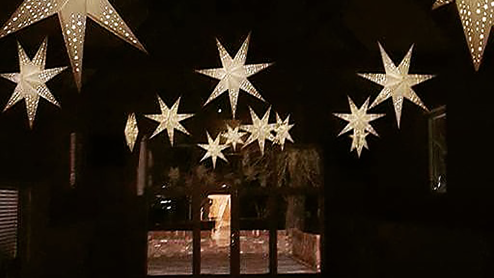Star lanterns offer alternative barn wedding decoration