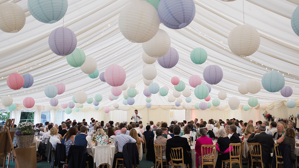 Pastel paper lanterns create a festival themed wedding