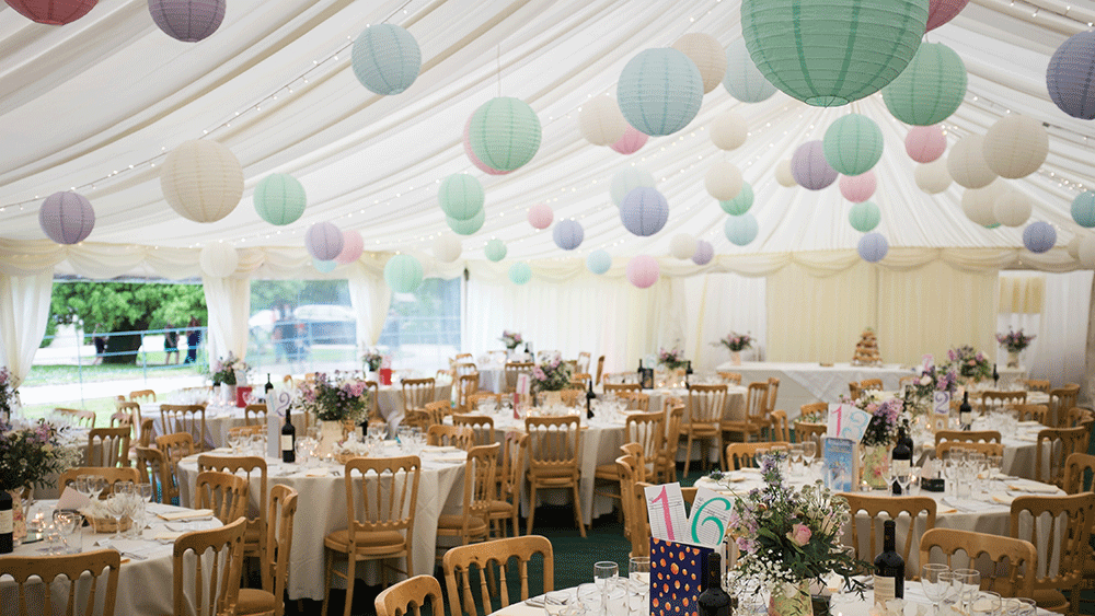 Pastel paper lanterns create a festival themed wedding