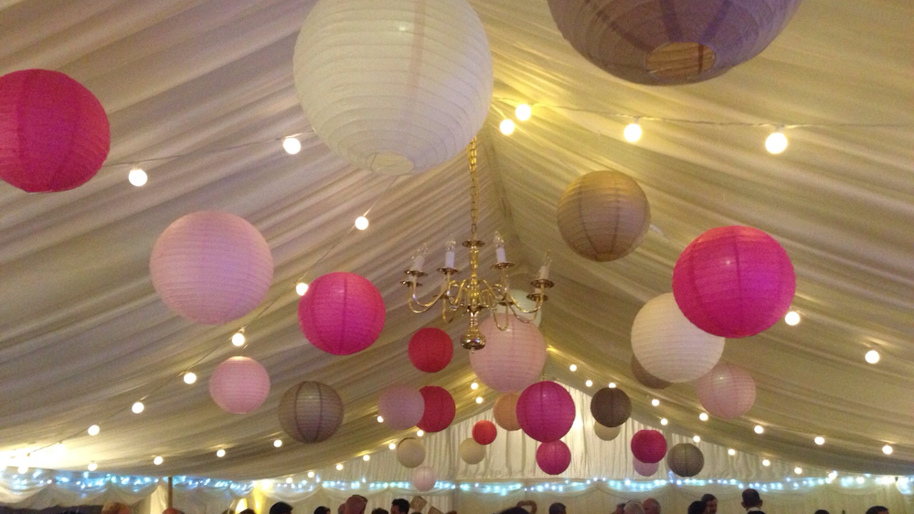 Latte and Pink Lanterns Decorate a Rustic Marquee