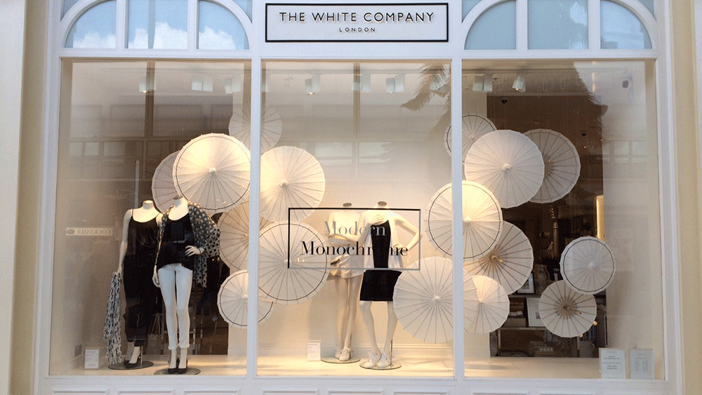 The White Company dress their windows with Paper Parasols