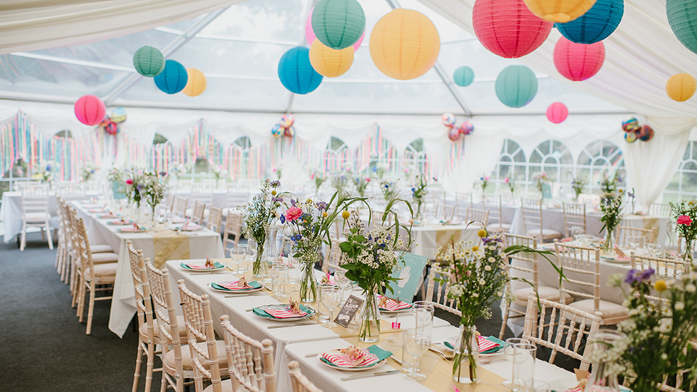 Garden festival themed coloured lanterns dress Sussex Bell End Tent