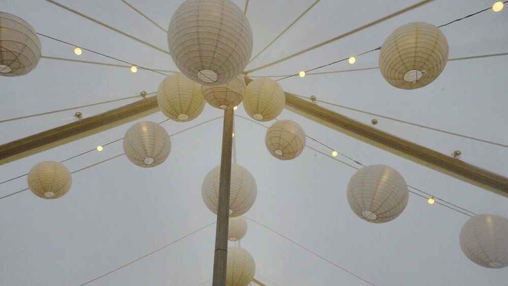 White and Cream Paper Lanterns Dress a Traditional Somerset Marquee