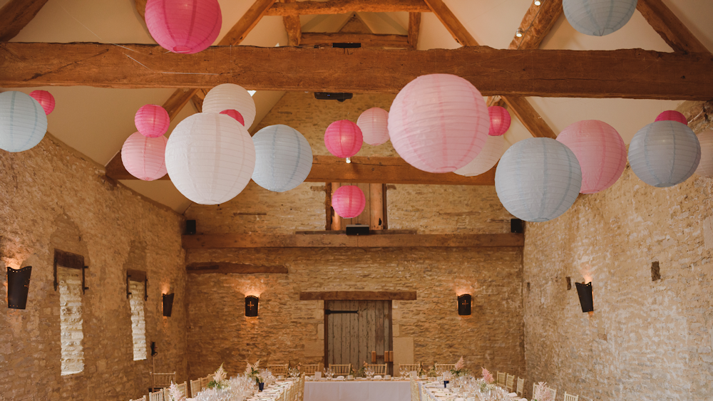 Pink and blue paper lanterns create a fabulous feature in Oxleaze Barn