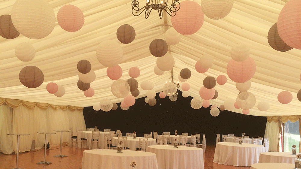 Latte and Lace hanging lanterns adorn Scottish wedding marquee