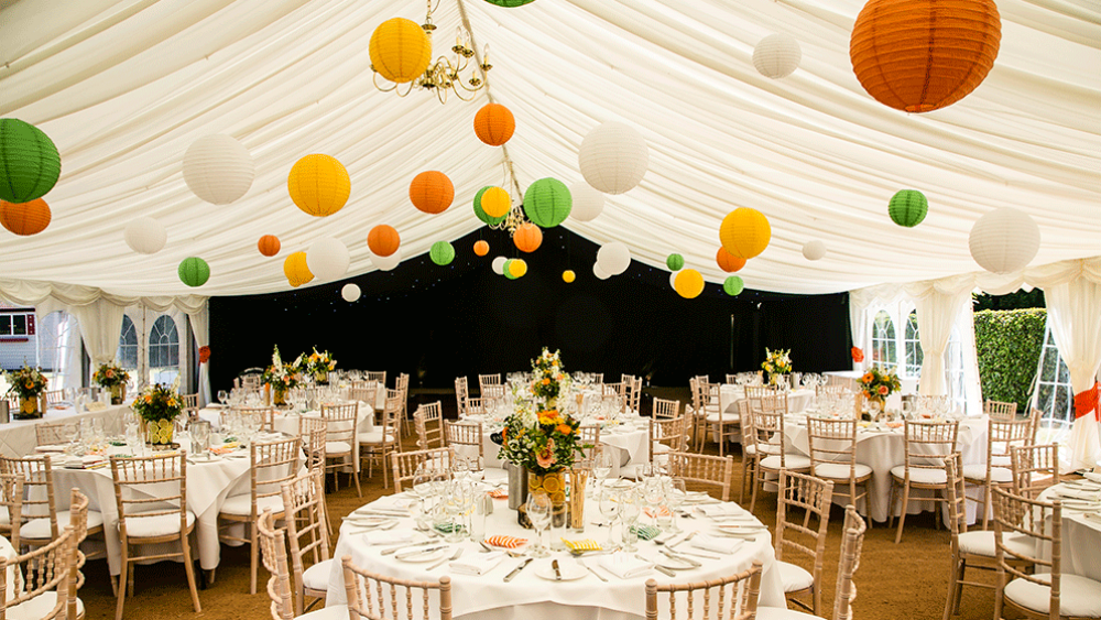 Brighten a white marquee with summery coloured lanterns