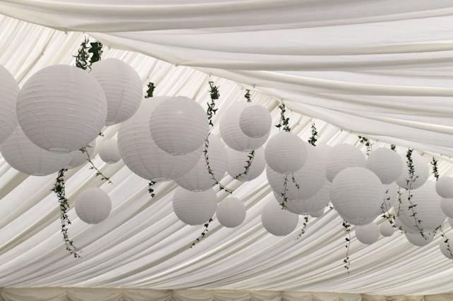 Hanging lanterns and ivy at wedding