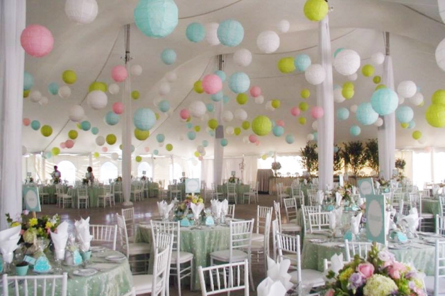 Pastel paper lanterns in wedding marquee