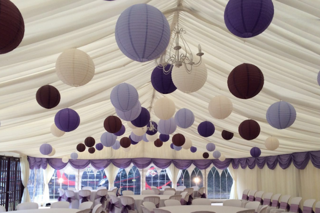 Purple paper lanterns decorate Sussex marquee wedding