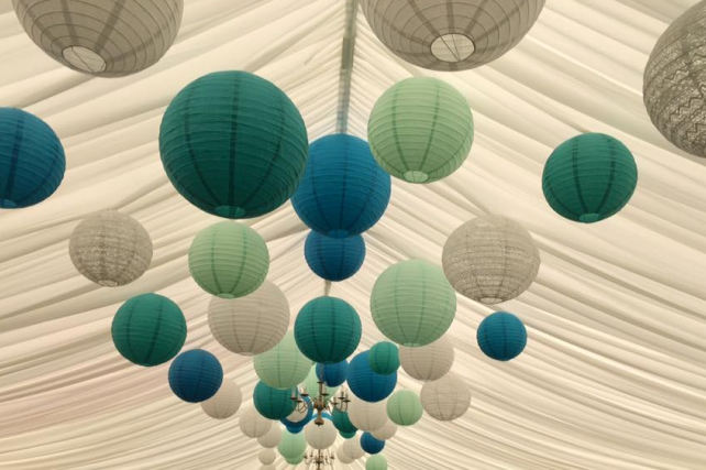 Green and blue hanging lanterns decorate Berwick Wine Centre