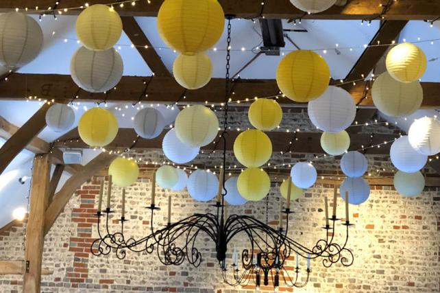 Upwaltham Barns decorated with Yellow Hanging Lanterns