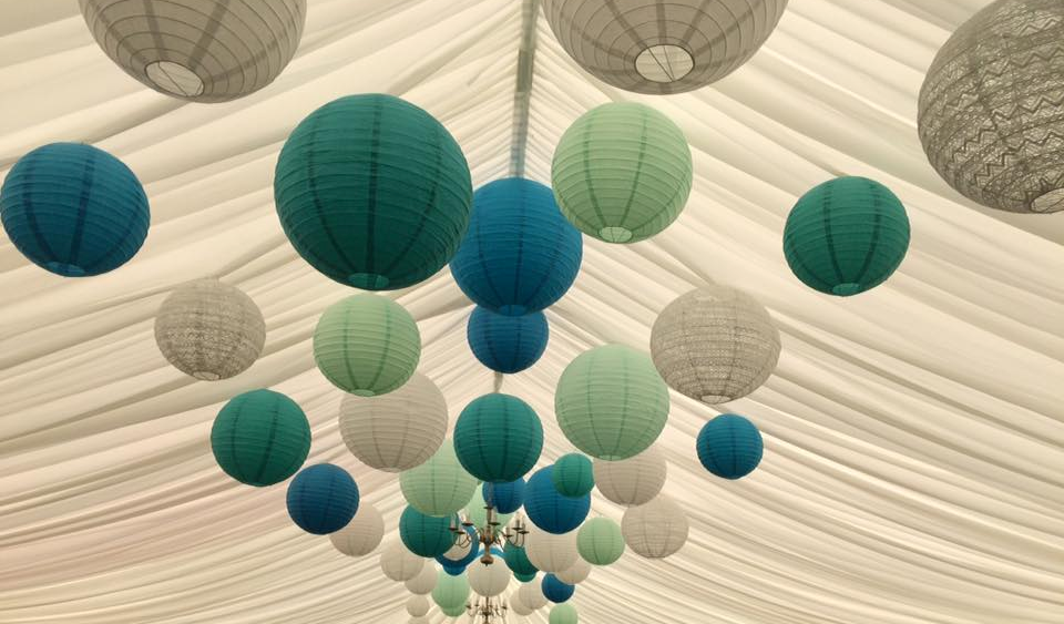 Green and blue hanging lanterns decorate Berwick Wine Centre