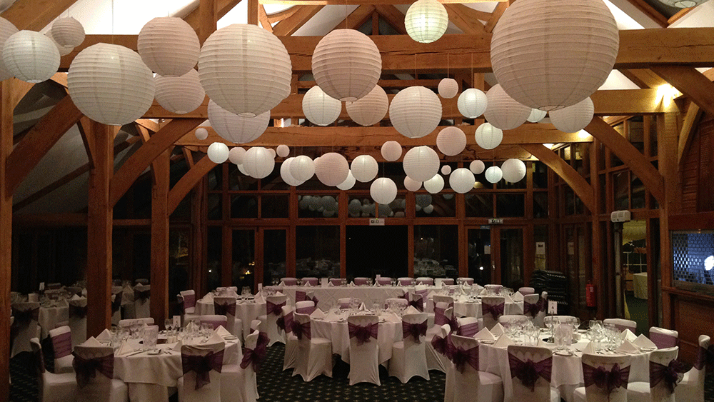 Gentle lantern tones soften the solid wood beams