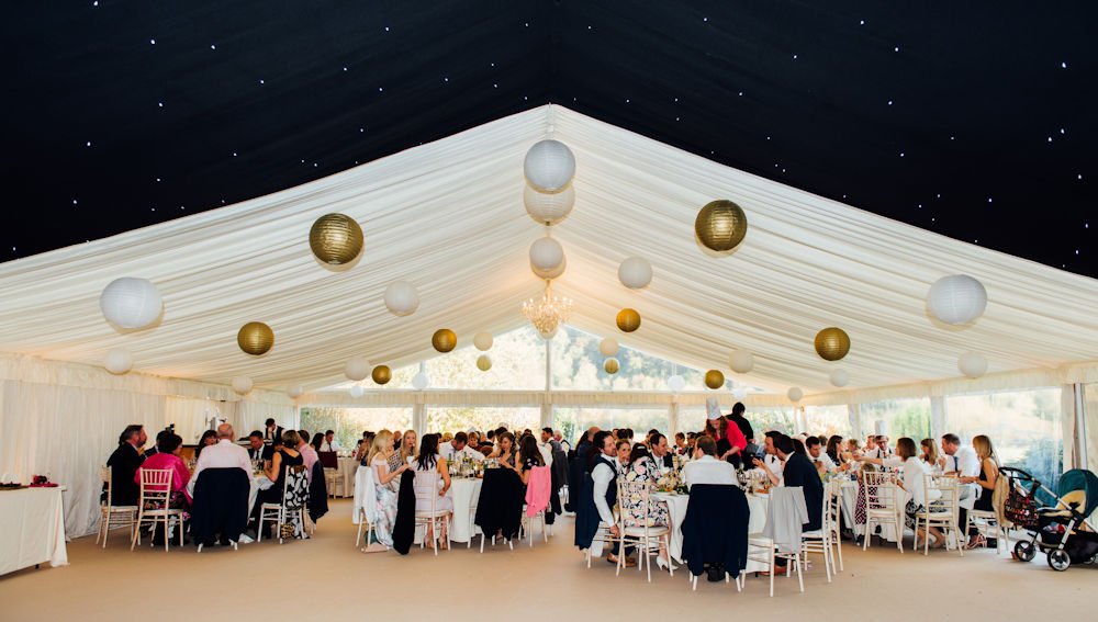 Simple gold and white wedding lantern canopy
