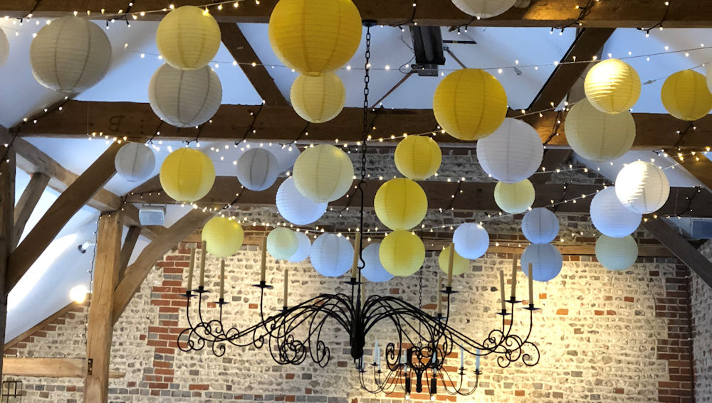 Upwaltham Barns decorated with Yellow Hanging Lanterns